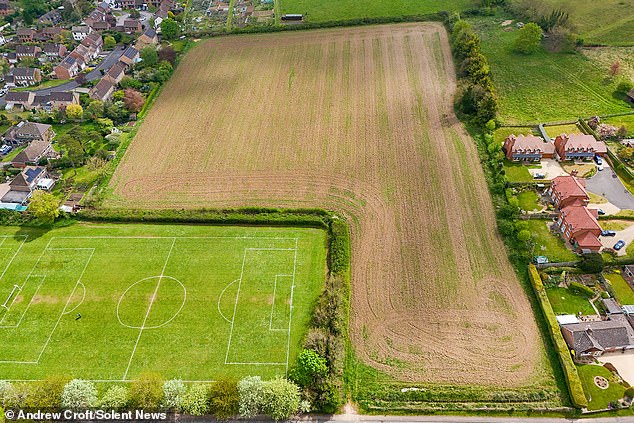 Goodworth Clatford, near Andover, dates back to the Saxon times and in 1086 was recorded in the Domesday Book. Pictured is where the development is proposed