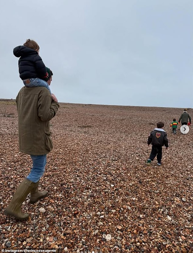 She also shared a photo of the family going for a walk along a pebbled beach