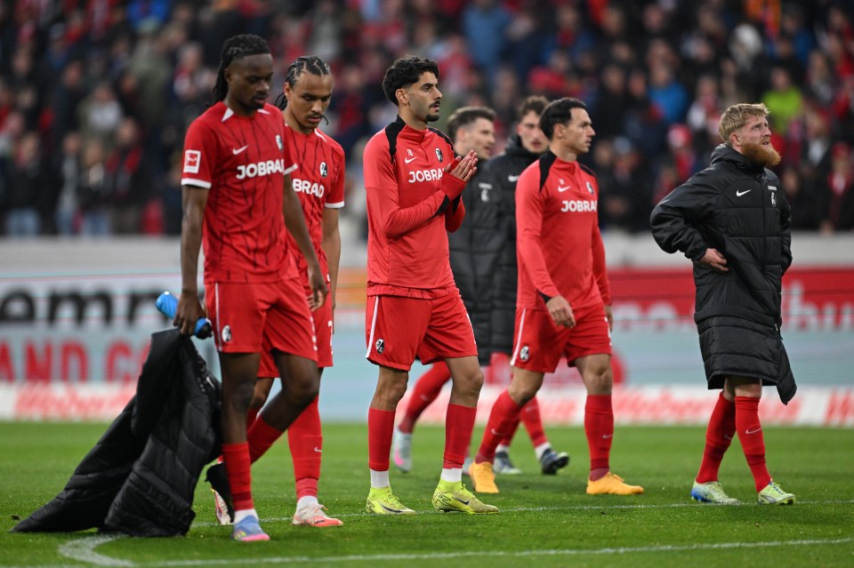 SC Freiburg soccer players thanking fans after a game.