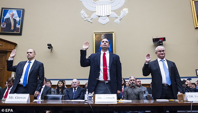 David Grusch (center) pictured with former pilot Ryan Graves (left) and Navy veteran fighter pilot Commander David Fravor (right) as they were sworn in to give testimony to Congress on July 26, 2023