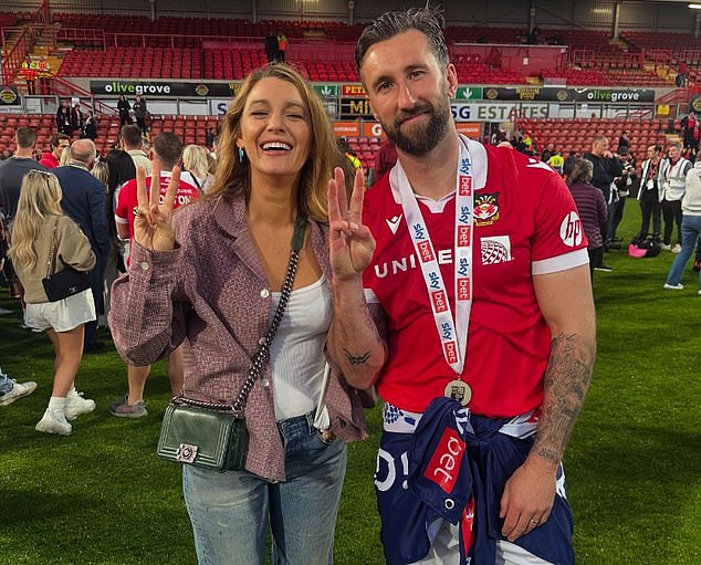 He is also supported by wife Blake Lively (left), who was at Wrexham's win over Charlton