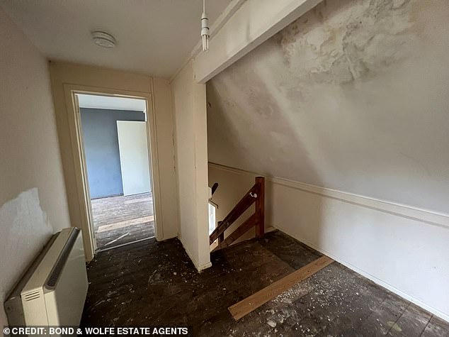 The first floor shows dirty floorboards where carpets have presumably been pulled up and large water stain hangs above