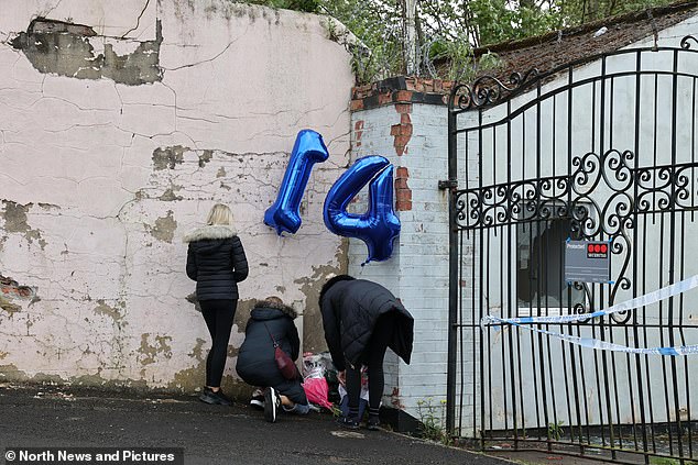 Well-wishers leave tributes outside the industrial estate where Layton Carr died on Friday