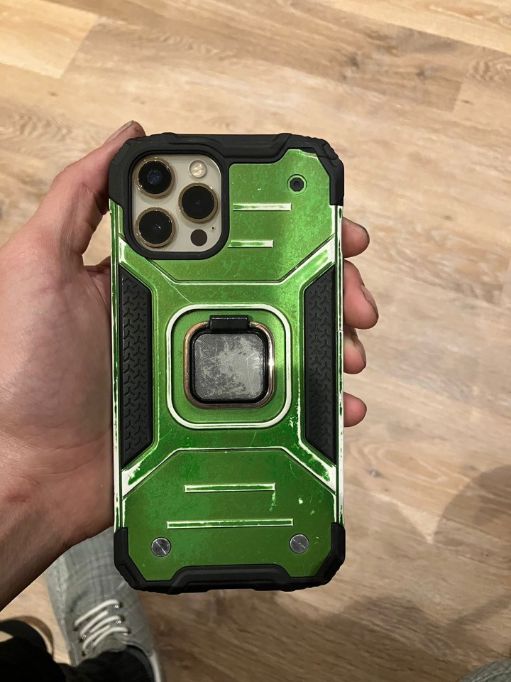 iPhone 13 in a green protective case.