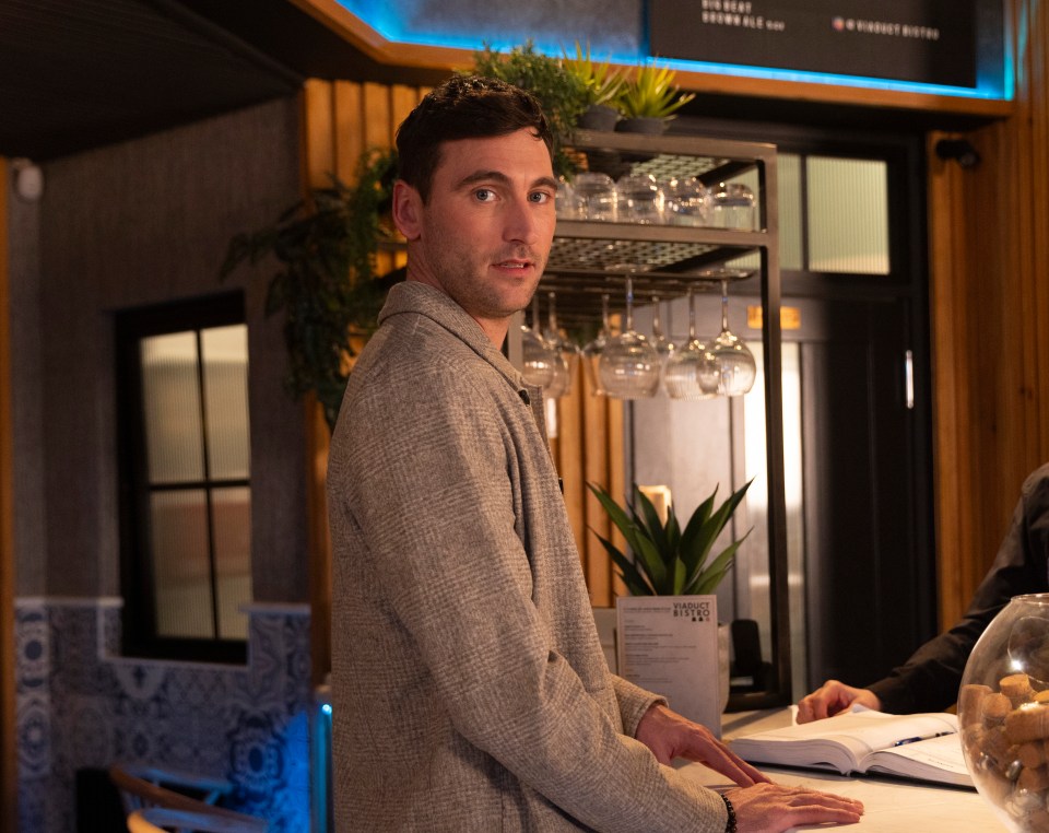 Theo, from Coronation Street, at a bistro.