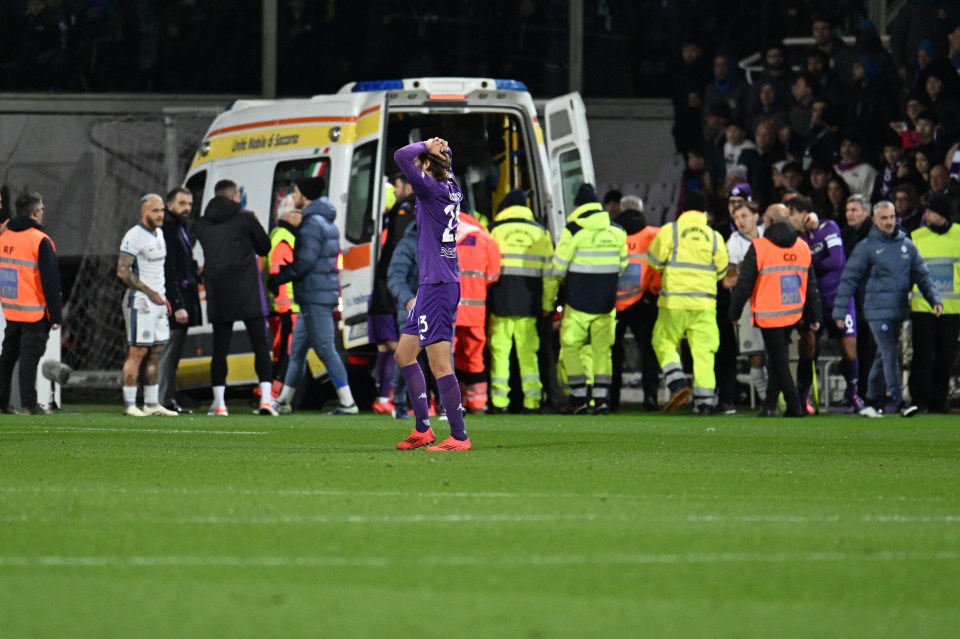 Soccer player being taken to hospital after collapsing on the field.