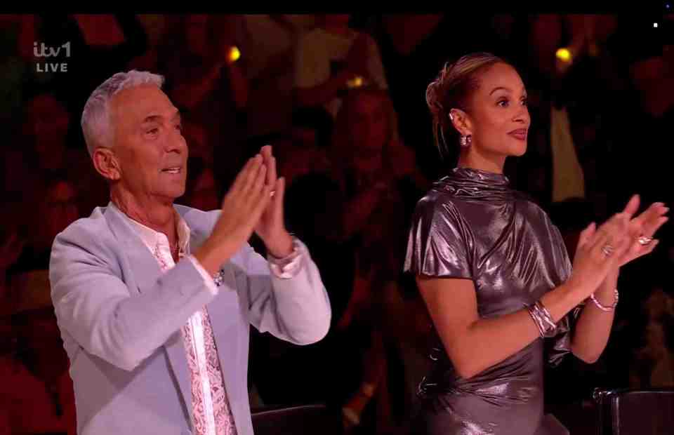 Two judges clapping during a live television show.