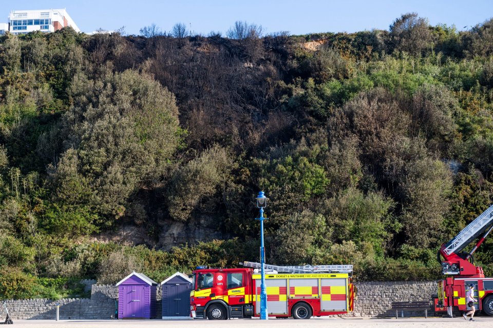 Firetruck at Bournemouth beach after a wildfire on the cliff.
