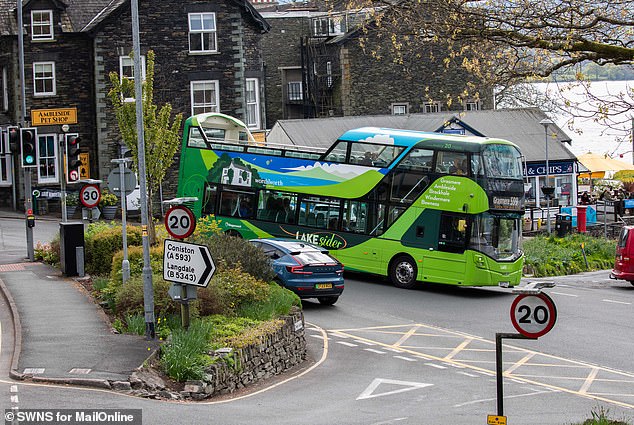 The open-top local bus service known as the Lakesider passes through Ambleside, on the northern edge of Windermere