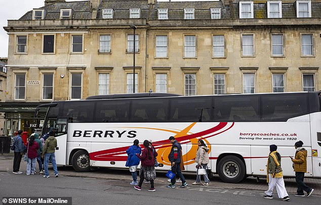 A coachload of tourists arrives in the city of Bath, in Somerset, which is also regularly overrun with visitors