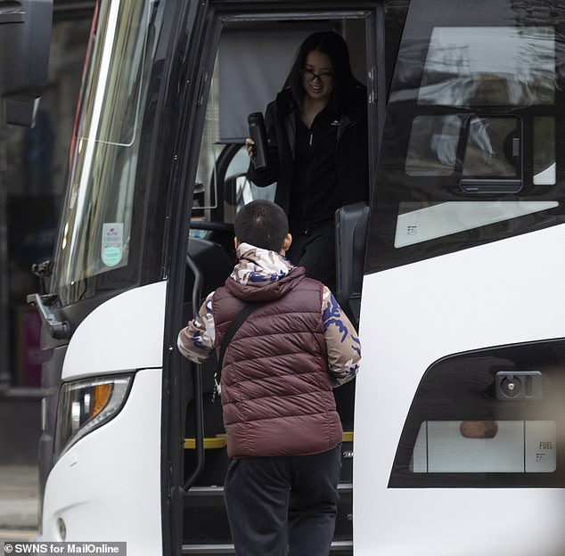 Tourists board their coach to leave Bath. The city has a number of dedicated coach drop-off points