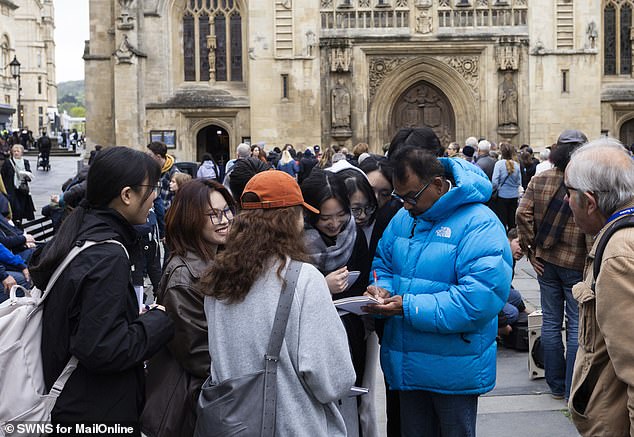 Tourists gathered outside Bath Abbey. 'It's a sign of the times', said one local of the parking issues in the city