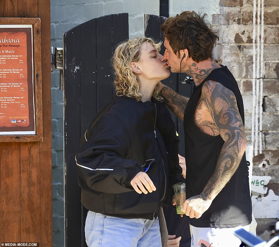 They were seen sharing a kiss on the lips as they reunited at the Sydney café