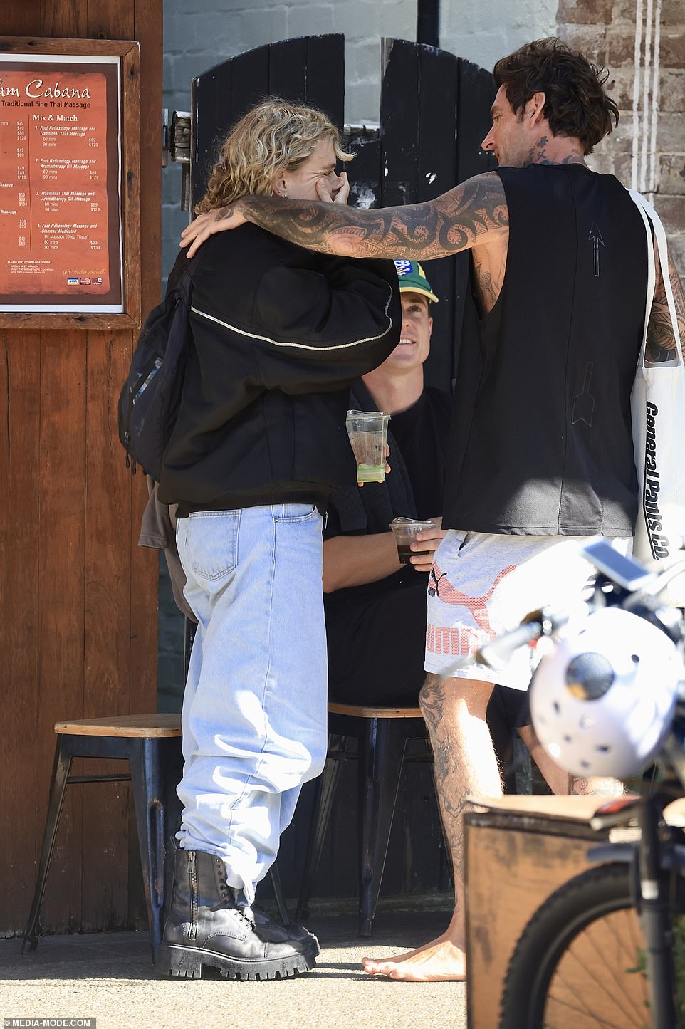 Kath kept warm in chunky black boots and carried a backpack during the outing