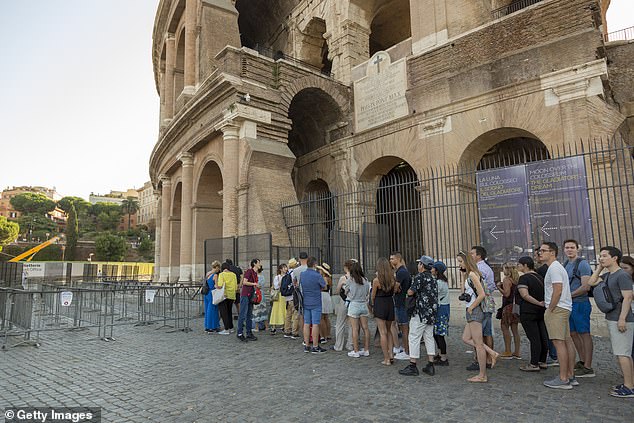 The 47-year-old was dangling from the fence and fell unconscious after becoming wounded at the iconic Roman landmark