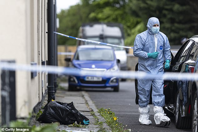 Pictured: Police forensic officers search a house on May 04, 2025 in Rochdale, England, following a counter terrorism raid