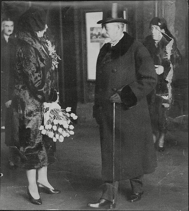 King George V chatting with Queen Victoria of Spain at Victoria Station