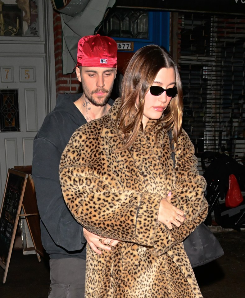 Justin and Hailey Bieber leaving a pizza restaurant.