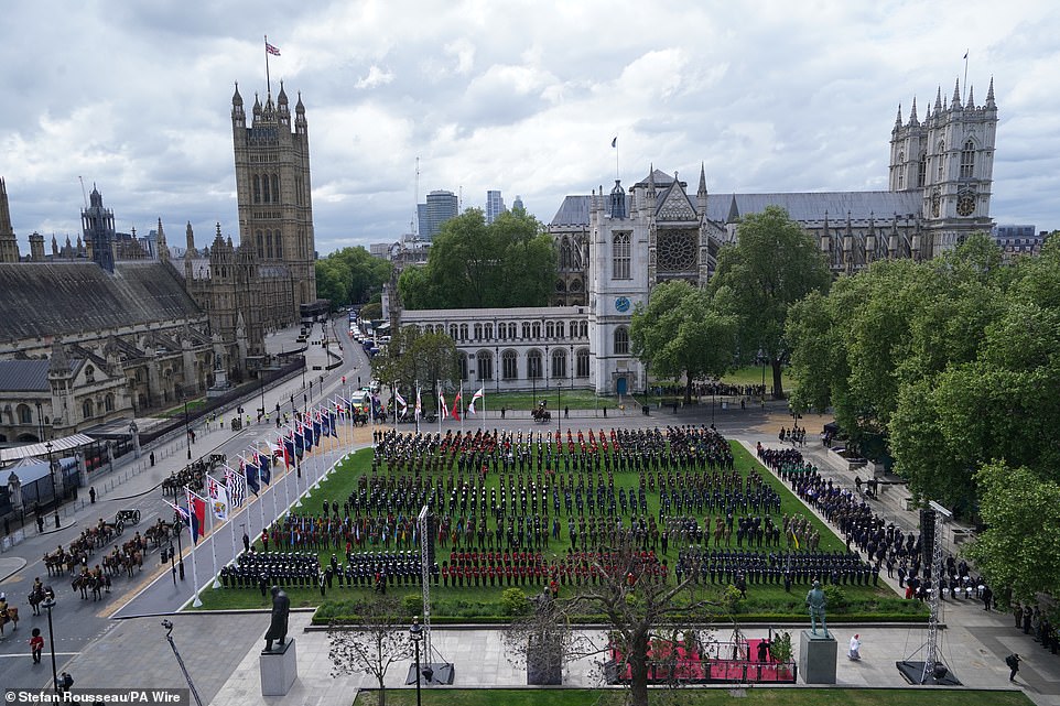 Military personnel take up their positions in Parliament Square this morning ahead of the military procession for VE Day 80