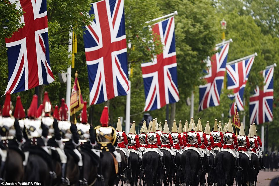 Members of the Household Cavalry Mounted Regiment ahead of the military procession through Central London today