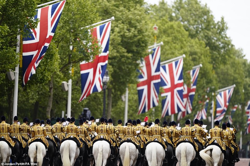 Members of the Band of the Household Cavalry ahead of a military procession marking the 80th anniversary of VE Day today