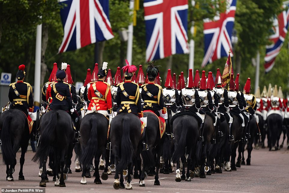 Members of The Blues and Royals Squadron of the Household Cavalry Mounted Regiment ahead of the procession today