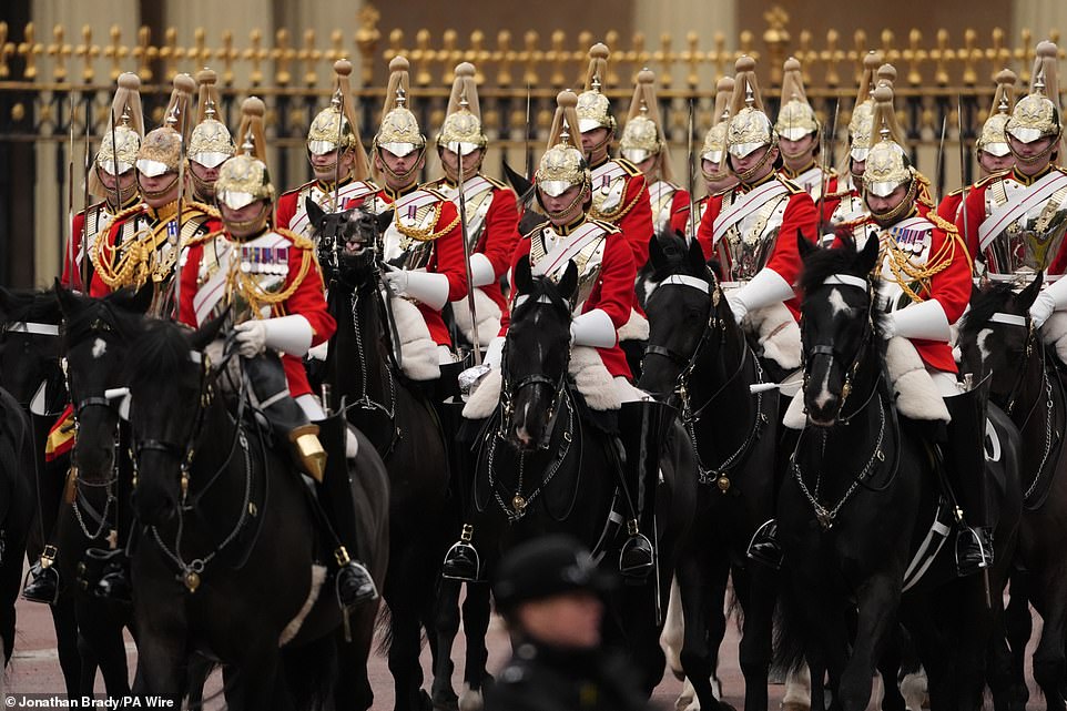 Members of the Household Cavalry Mounted Regiment ahead of the military procession through Central London today