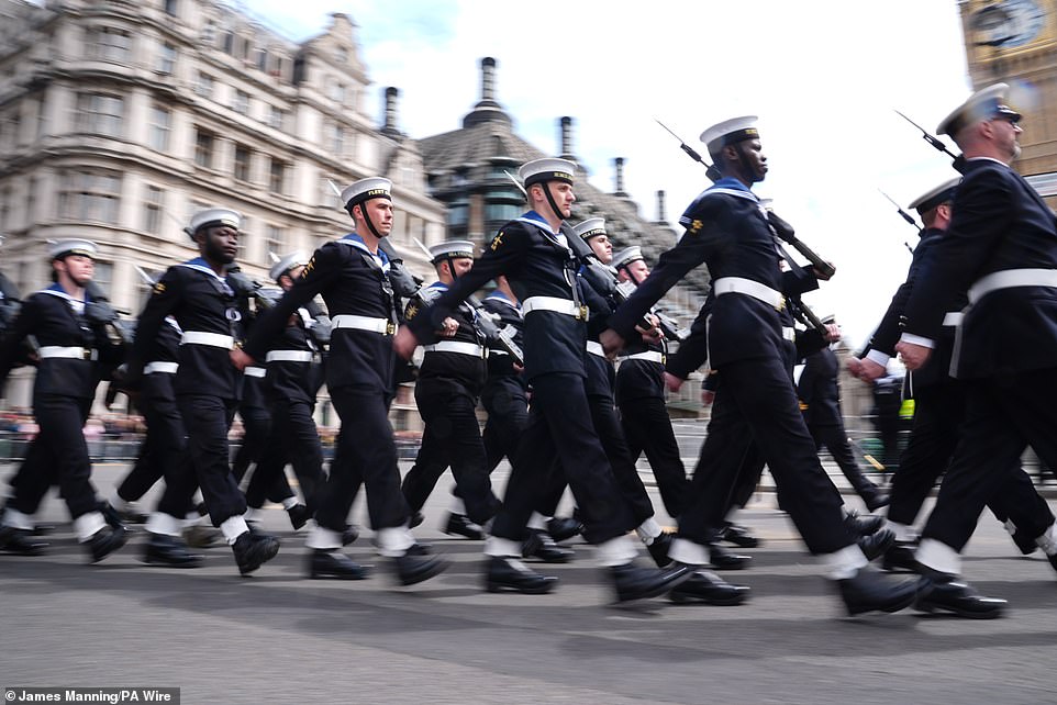 Members of the Royal Navy march past Parliament Square in London this morning to mark the 80th anniversary of VE Day