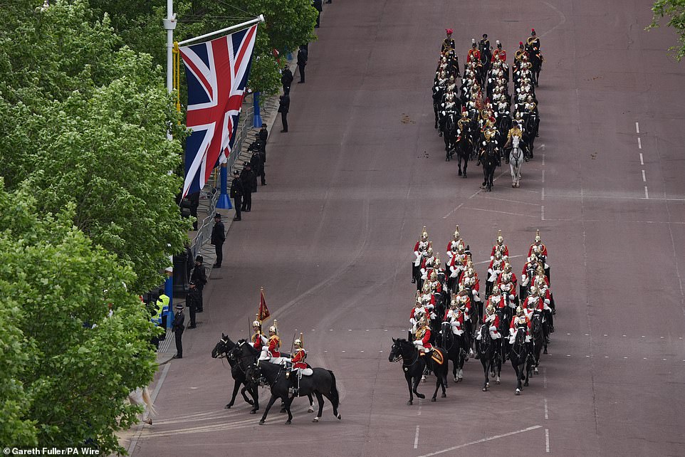 Members of the Household Cavalry Mounted Regiment this morning ahead of the military procession in Central London