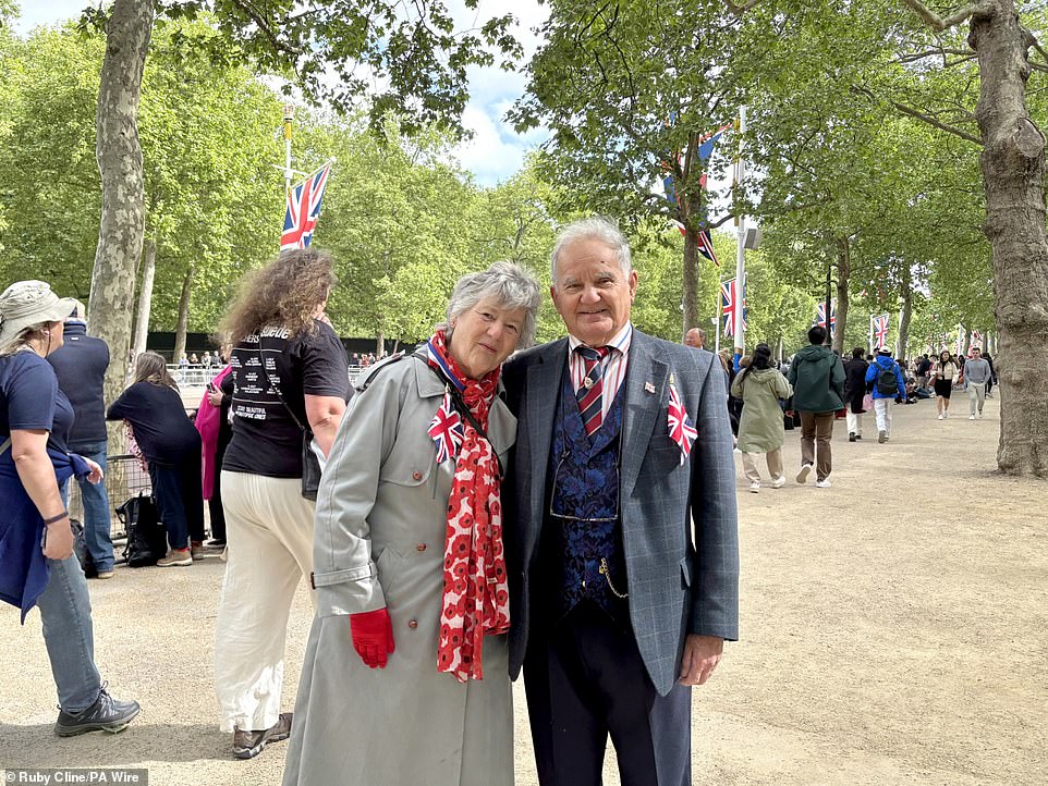Muriel Smith, 77, and her husband David Smith, 79, a military royal engineer from 1960 to 1972, join crowds on The Mall today