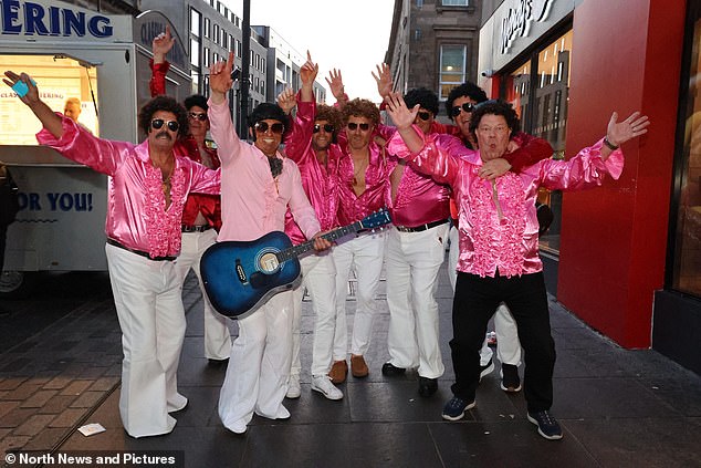Several male revellers were spotted in football shirts and even Elvis Presley costumes as they partied late into the night