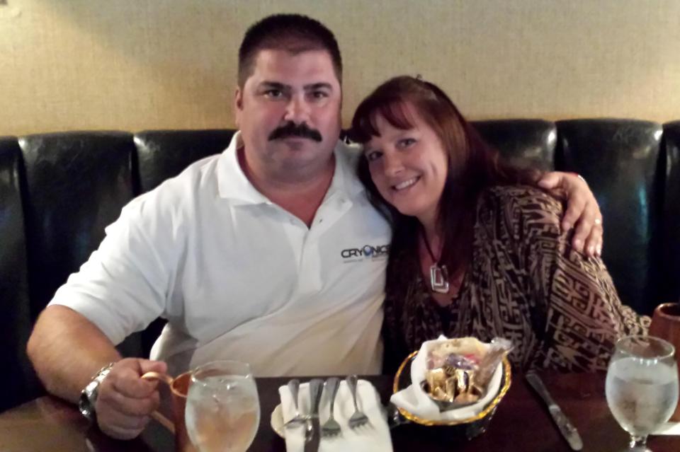 Couple sitting together at a restaurant.