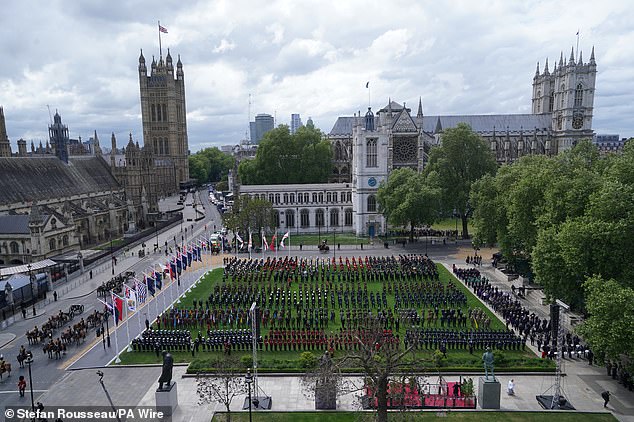 Military personnel take up their positions in Parliament Square this morning ahead of the military procession for VE Day 80