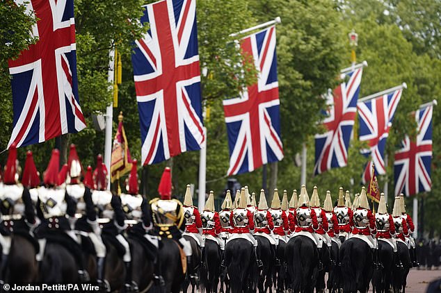 Members of the Household Cavalry Mounted Regiment ahead of the military procession through Central London today