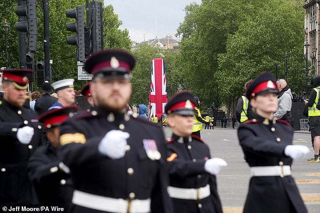 Members of the military march near Parliament Squareahead of a military procession marking the 80th anniversary of VE Day