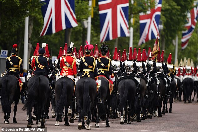 Members of The Blues and Royals Squadron of the Household Cavalry Mounted Regiment ahead of the procession today