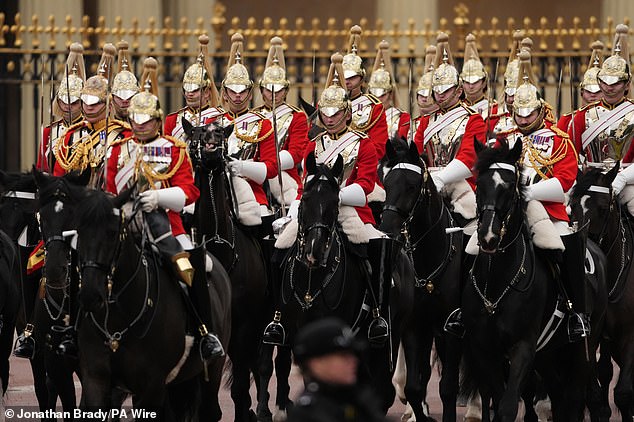 Members of the Household Cavalry Mounted Regiment ahead of the military procession through Central London today