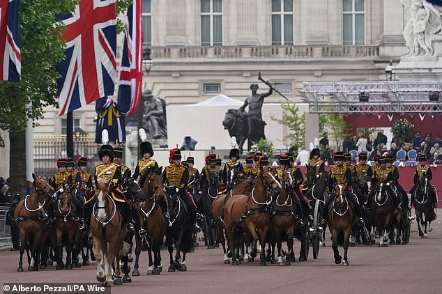 Members of the Royal Horse Artillery make their way down The Mall ahead of the military procession in London today
