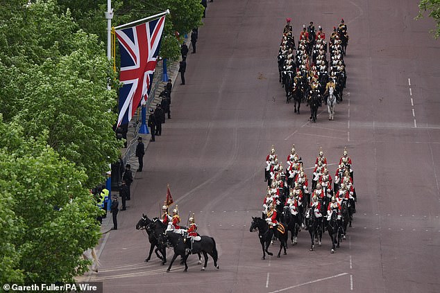 Members of the Household Cavalry Mounted Regiment this morning ahead of the military procession in Central London
