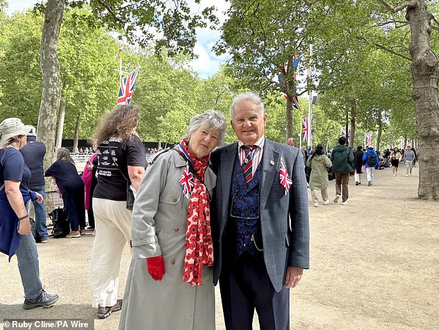 Muriel Smith, 77, and her husband David Smith, 79, a military royal engineer from 1960 to 1972, join crowds on The Mall today