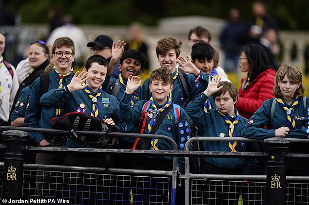 Scouts gather ahead of the military procession marking the 80th anniversary of VE Day in London this morning