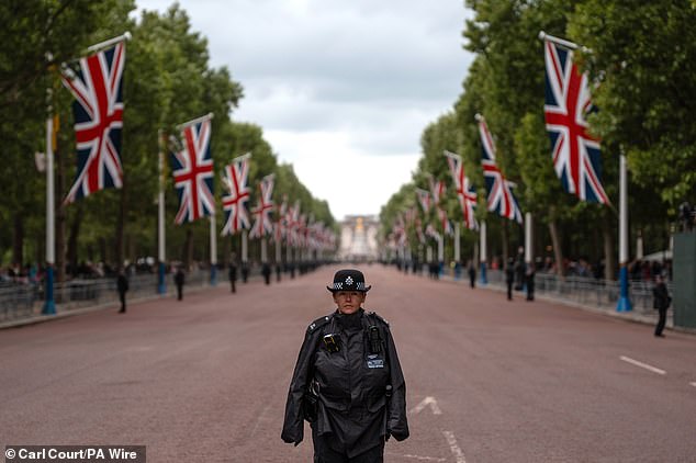 Police officers guard The Mall this morning ahead of a military procession marking the 80th anniversary of VE Day