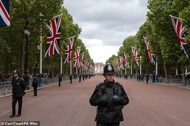 Police officers guard The Mall this morning ahead of a military procession marking the 80th anniversary of VE Day