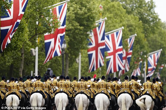 Members of the Band of the Household Cavalry take part in a procession celebrating the 80th anniversary of VE Day today