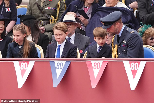 (From left) Princess Charlotte, Prince George, Prince Louis and the Prince of Wales ahead of the military procession today