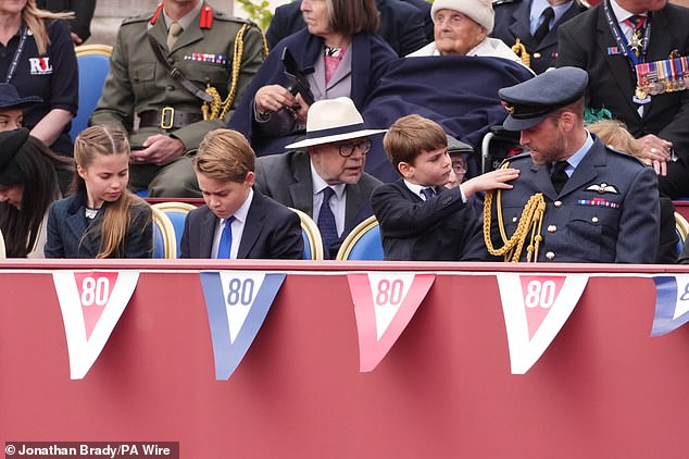 (From left) Princess Charlotte, Prince George, Prince Louis and the Prince of Wales ahead of the military procession today
