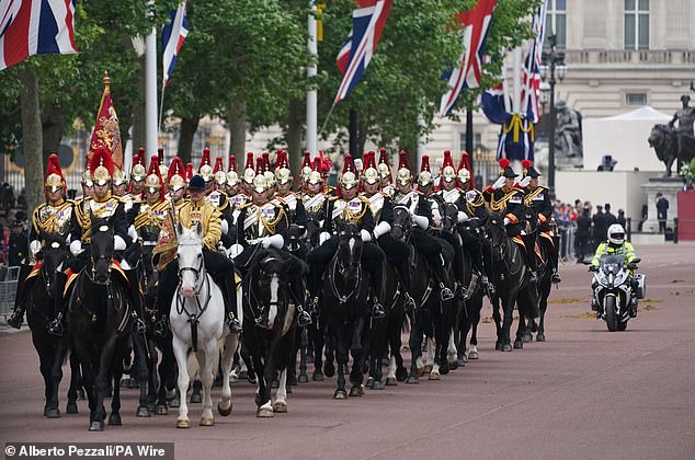 Members of the Household Cavalry Mounted Regiment parade on The Mall ahead of the military procession today