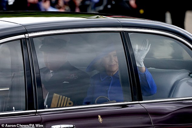 King Charles III and Queen Camilla arrive for the military procession marking the 80th anniversary of VE Day in London today