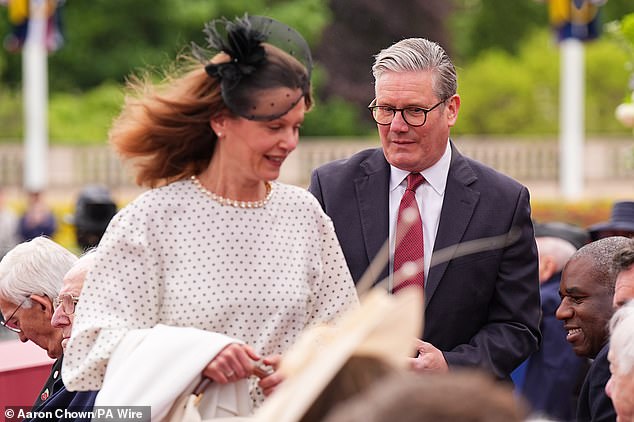Prime Minister Sir Keir Starmer and his wife Lady Victoria arrive ahead of the military procession for VE Day 80 today