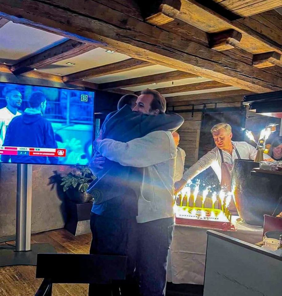 Harry Kane and Eric Dier hugging after a Bayern Munich victory.